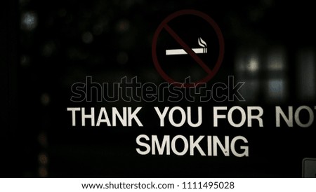 thank you for no smoking sign on business glass
