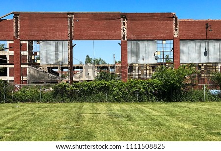 Abandoned Detroit Michigan factory next to a cemetery. 