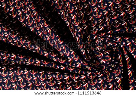 texture. Drawing. Cloth with a picture on the sea theme. Anchors. Install the sail in this True Navy Anchor Printed Cotton Poplin. this poplin can help you create delightful tops for any occasion.