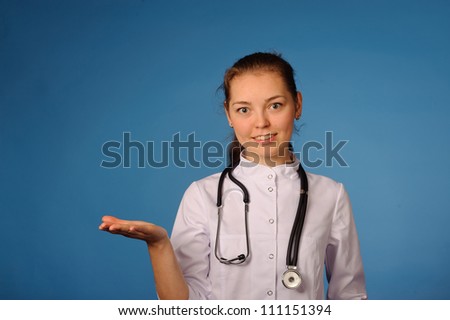 Portrait of a young friendly female doctor