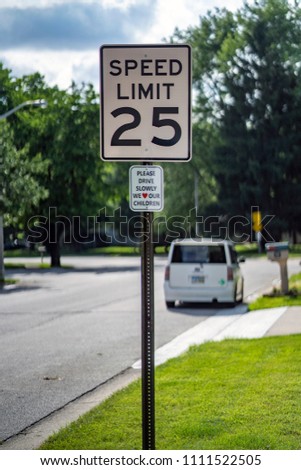 Twenty Five Miles an Hour Sign Post in Neighborhood