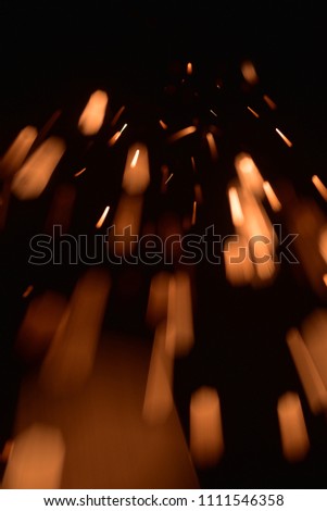 Bokeh lights on  white background,shot of flying fire sparks in the air,Firestorm texture. 