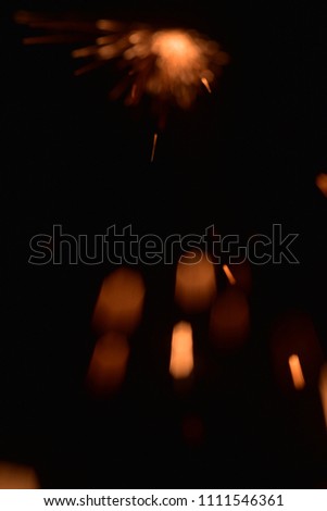 Bokeh lights on  white background,shot of flying fire sparks in the air,Firestorm texture. 