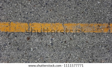 Asphalt road with yellow line 