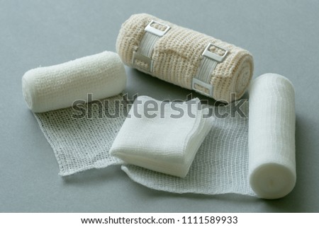 Medical bandages on gray background. Medical equipment.