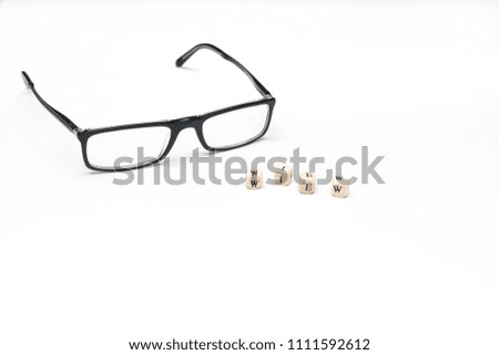 the word view and a pair of glasses on a white surface