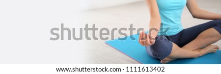Focus on woman doing yoga exercises, template