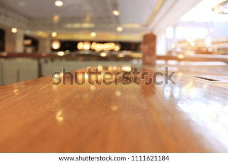 Wooden board blurred restaurant background.