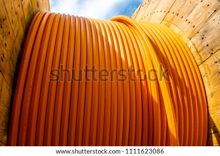 modern cable drum close-up at a construction site Royalty-Free Stock Photo #1111623086