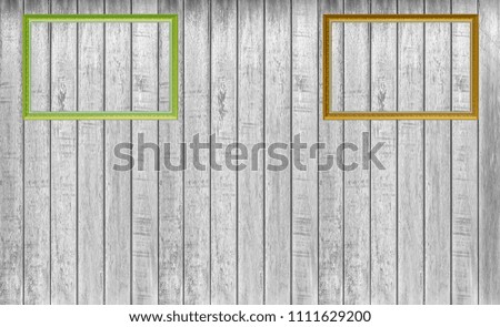 Picture frame on gray wooden wall background