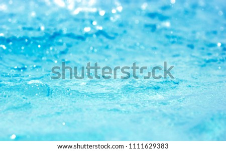 Bokeh light background in the pool Blue water