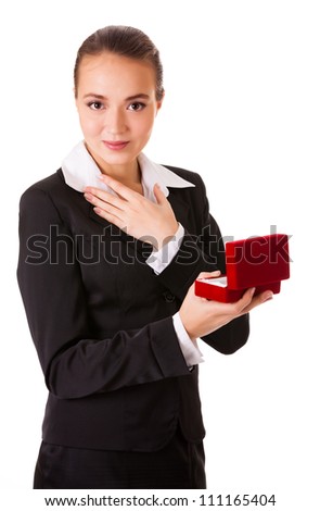 Admired business woman with open jewel box. Isolated on white background