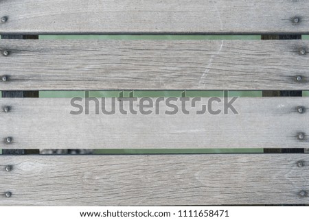 texture of gray or black wood vertical line with green water background