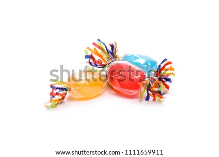 Colorful candies with transparent cellophane wrapping isolated on white background  Royalty-Free Stock Photo #1111659911