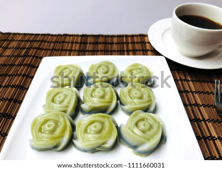 Rose shaped Thai sweet meat ,classy sweet desserts on a plate ,khanom chan