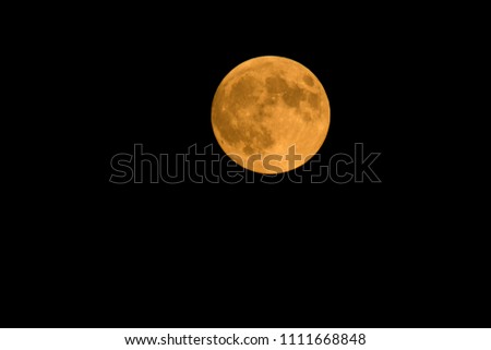 Full moon, isolated in the black sky