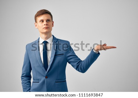    business man thinks holds his hand free                            