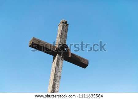 wooden cross with a statue of Jesus