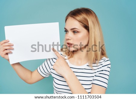 woman holds a sheet of paper seat free                         