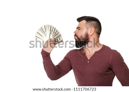 happy handsome man with beard holding money dollar bills