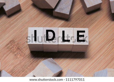 Idle Word Written In Wooden Cube