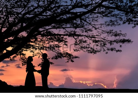 lover under the tree silhouette styles on the sunset