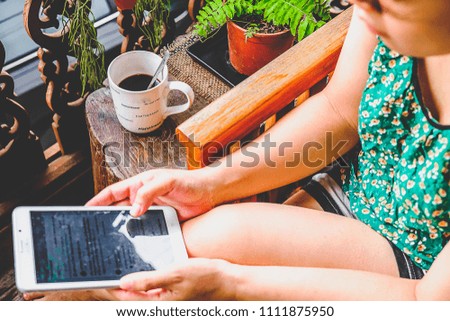 Relaxed Woman Playing Phone