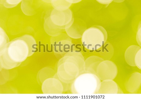 Abstract blurred yellow bokeh background from natural
