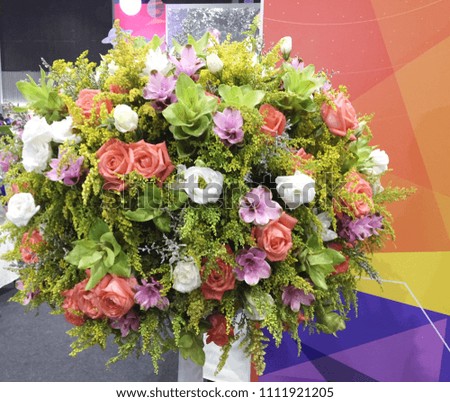 Various flowers in bright vase