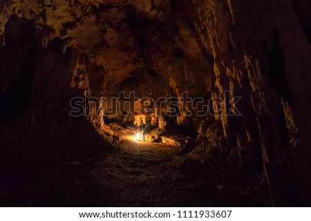 Silhouette women tourist with the lantern inside Tham Lod cave Pai, Mae Hong Son, Tham Lod Cave one of the most amazing cave in Thailand.