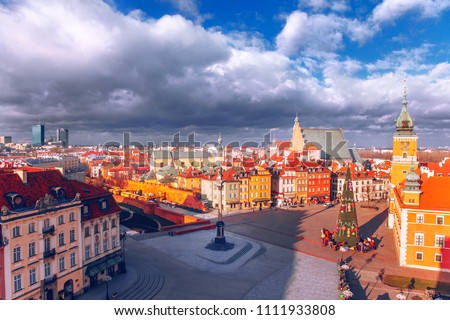 Panorama of Warsaw. Old square in Poland. Winter and Christmas tree. Blue sky and clouds. Pretty view. Colorful houses. Polska. Choinka.