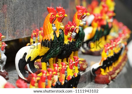 group of Decorative crafting colorful ceramic chicken figurine, handmade souvenir in Asia for home decoration, advertisement