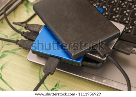 External disk hard drive connected to notebook for backup from computer data