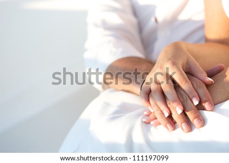 couple holding hands Royalty-Free Stock Photo #111197099