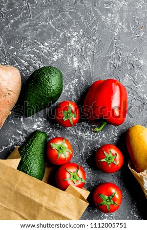 avocado and tomato with bread on table background top view mock 
