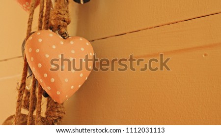 Vintage polkadot heart hanging on wall.  Love or Valentines card idea.