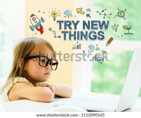 Try New Things text with little girl using her laptop