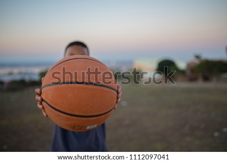 Player holding out basketball
