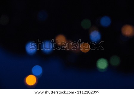 Abstract blur of a colored sparks bokeh background. Blurred defocused lights in colored tones. Blurred Bokeh. Christmas light background.