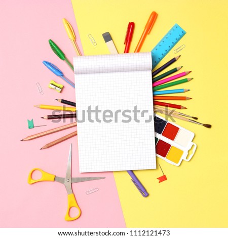 set of stationery on a colored background with space for text. back to school. office tools. flat lay, top view