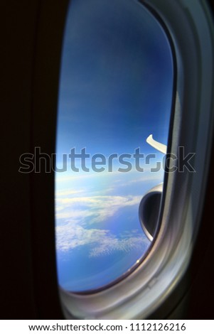 Blue sky above the clouds from an air plane window.