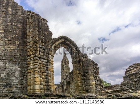Looking through the  old stone entrance to The Old Transept Ancient Ruins Kilwinning Abbey Scotland.