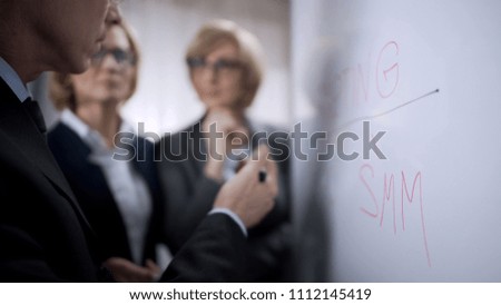 Head of department giving business tasks to his female colleagues, visualization