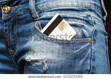 Closeup of credit card in jeans trousers pocket