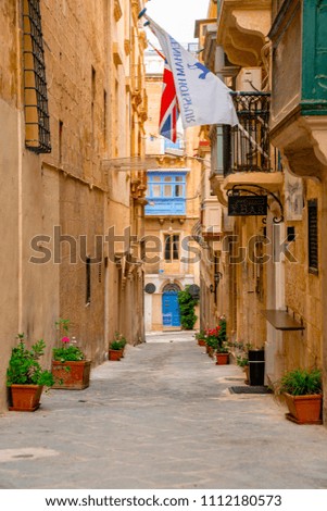 Valletta, Malta - The traditional houses, narrow streets and walls of Valletta, the capital city of Malta on an early summer morning before sunrise