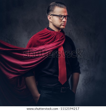 Portrait of a genius villain superhero in a black shirt with a red tie.