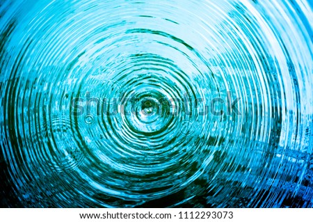 Top view Closeup blue water rings, Circle reflections in pool. Royalty-Free Stock Photo #1112293073
