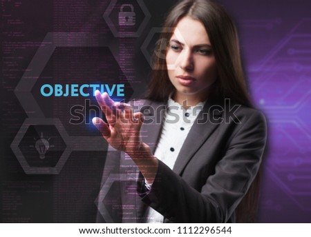 The concept of business, technology, the Internet and the network. A young entrepreneur working on a virtual screen of the future and sees the inscription: Objective