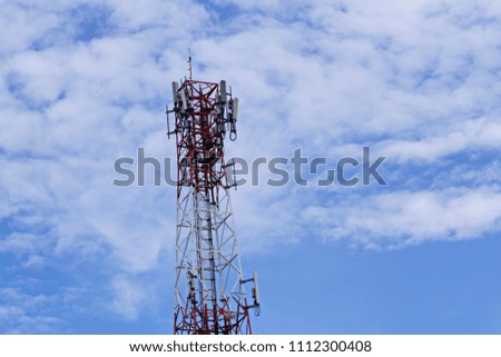 Cell Site 3G, 4G, 5G. Mobile phone base station aganist the blue sky cloud background. Development of communication systems in urban area. 