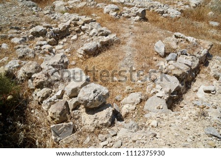 Minoan site at Petras close to the town of Sitia, Crete overlooking the sea from a small plateau. There is evidence that a palace got built  and houses. Inscriptions like the Minoan axe can be found